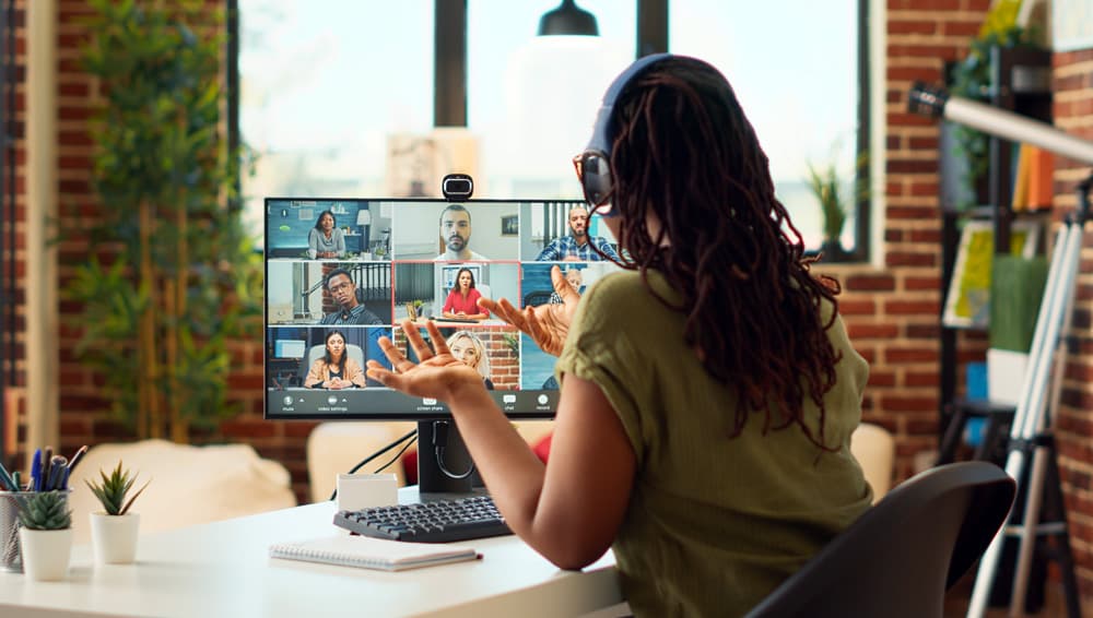 Kodora AI expert collaborating with a distributed team over video